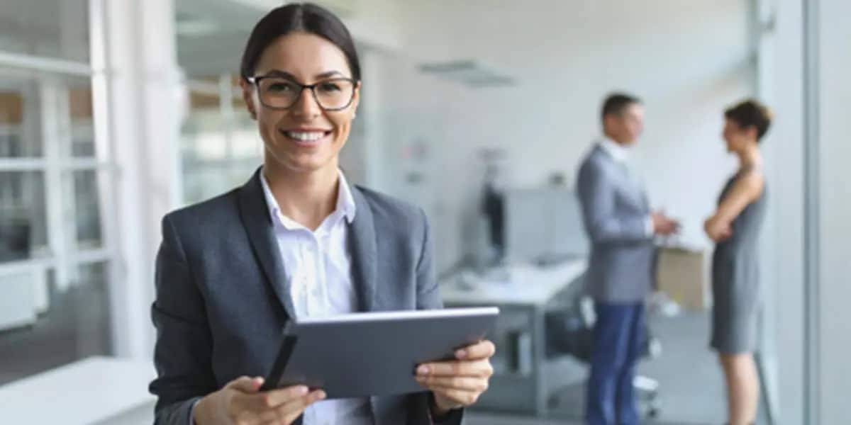 Businesswoman in glasses smiling at camera