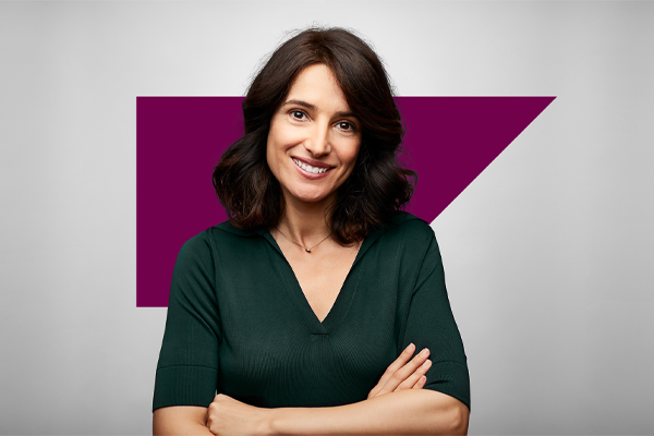 smiling woman with arms crossed