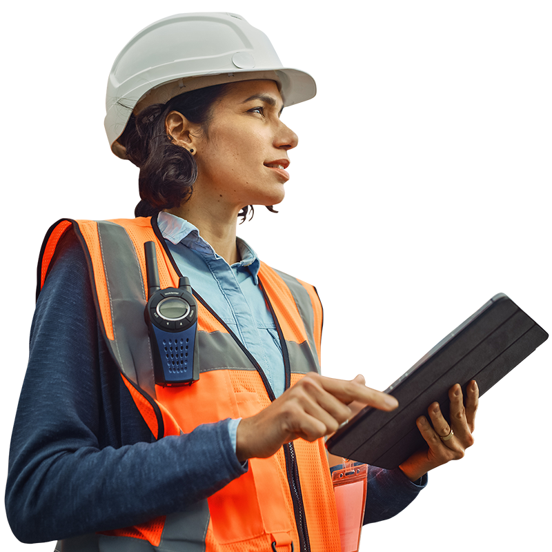person in hardhat and vest with tablet