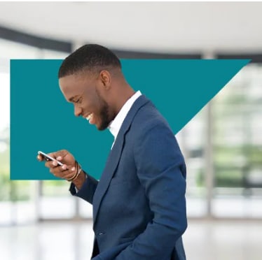 Man in suit, SAP Concur anvil logo in background