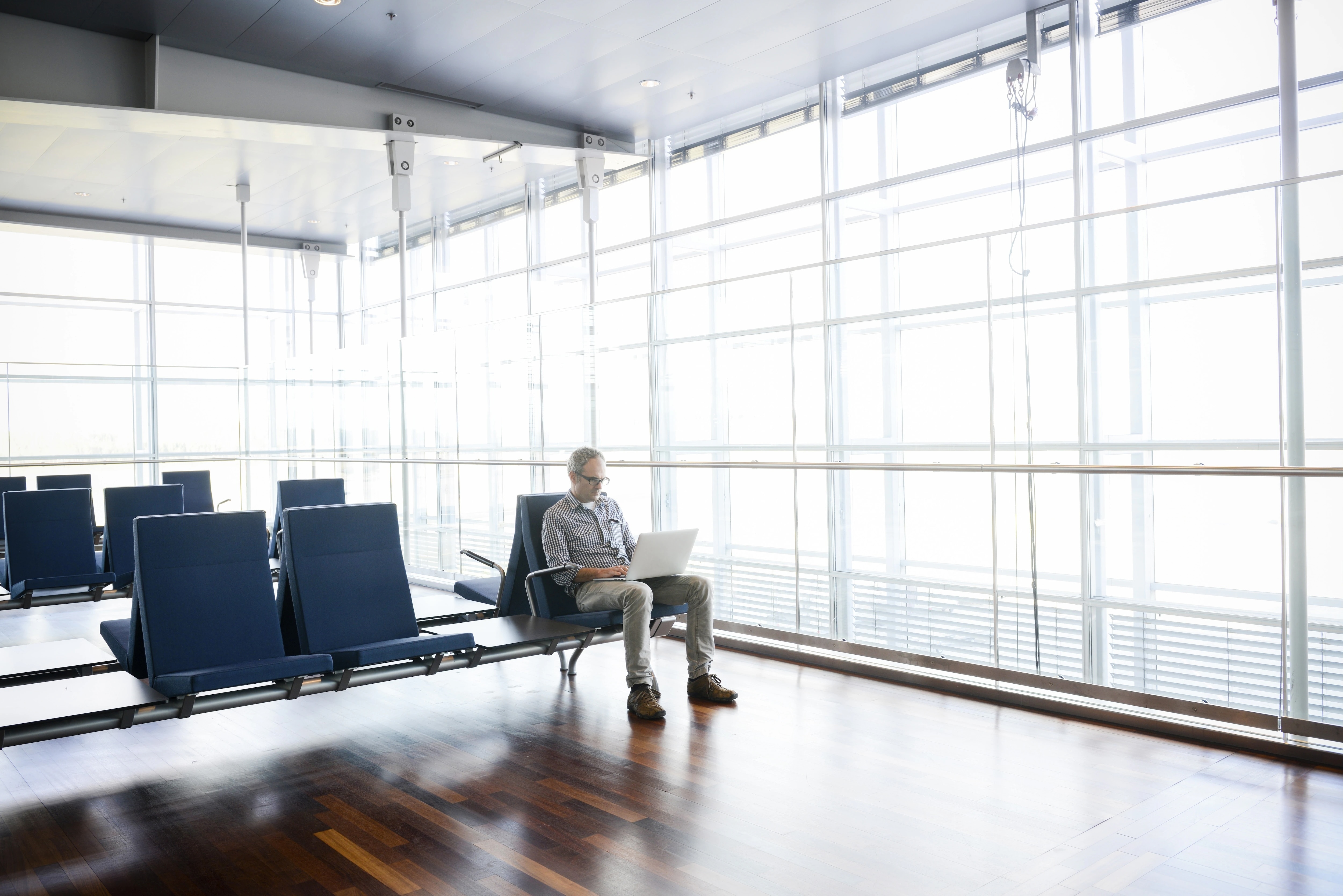Man sitting in airport waiting area