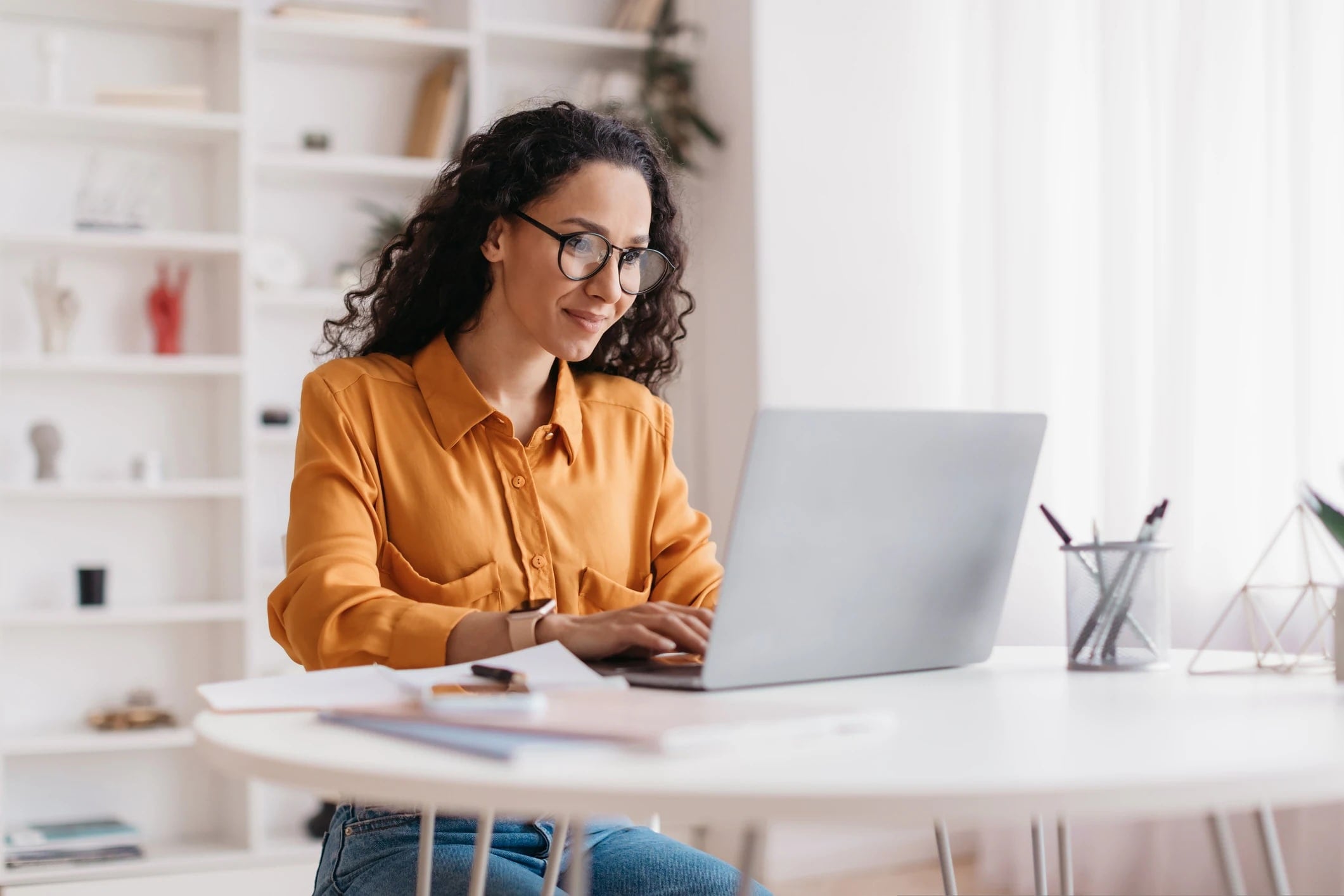 Woman sitting at laptop