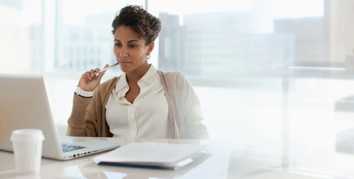 Woman looking at laptop