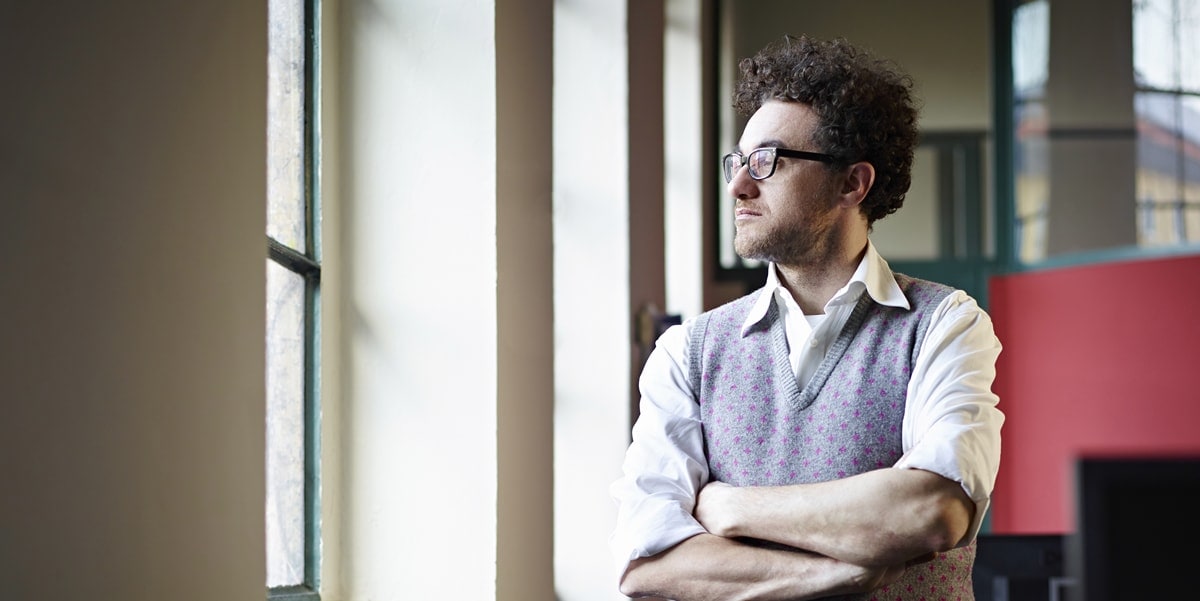 man looking out the window