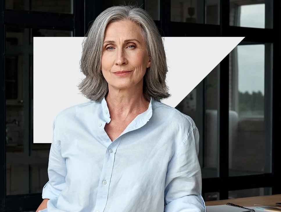 Grey haired woman in front of SAP anvil