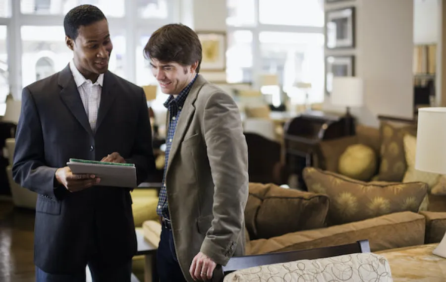 Two people looking at a document