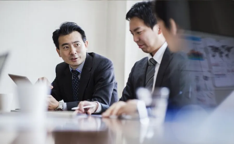 three people working in an office