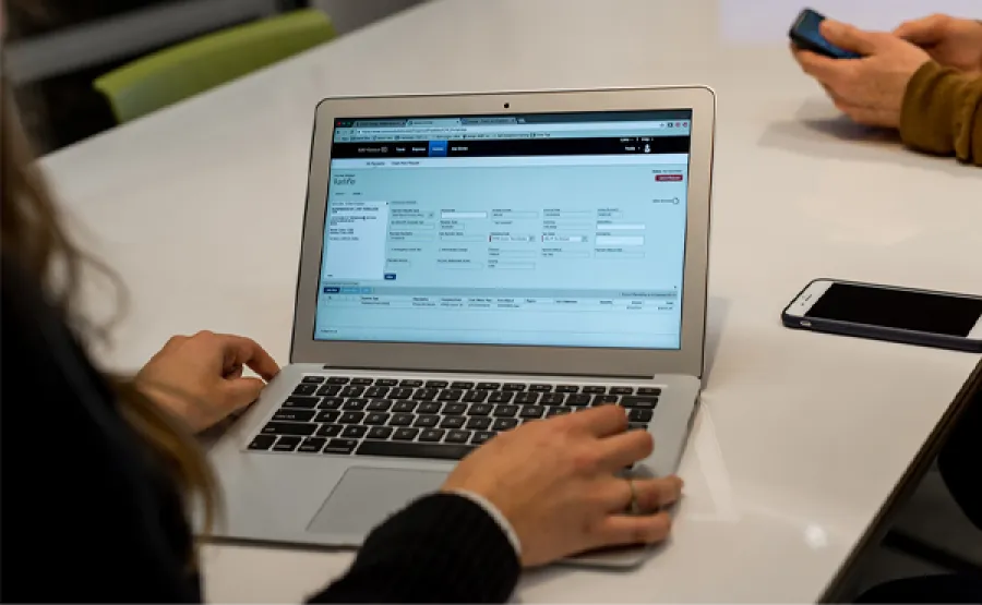 Person using invoice on a laptop