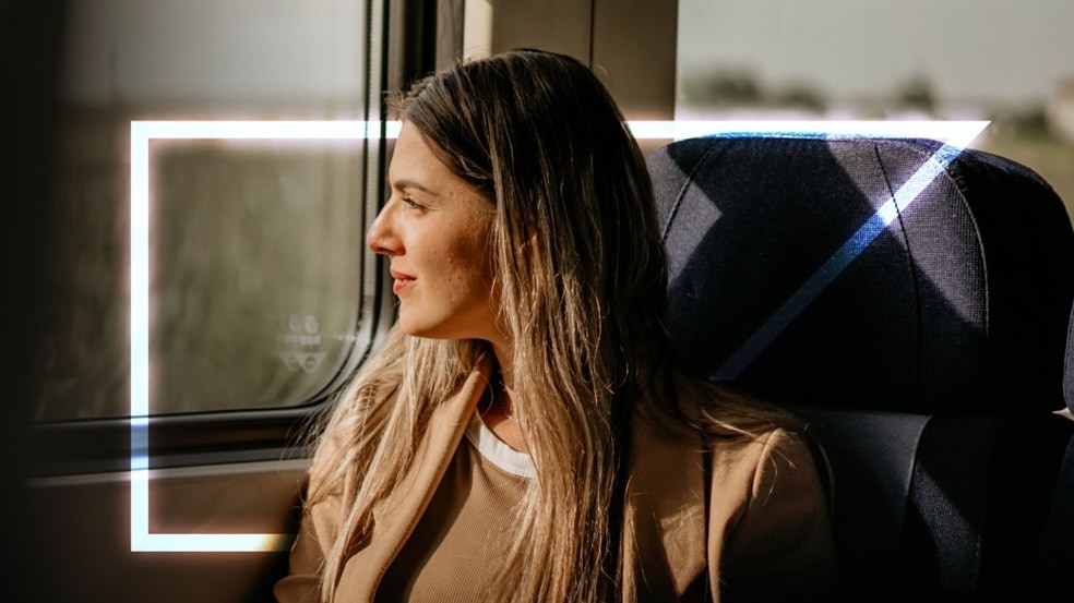 woman looking out a window