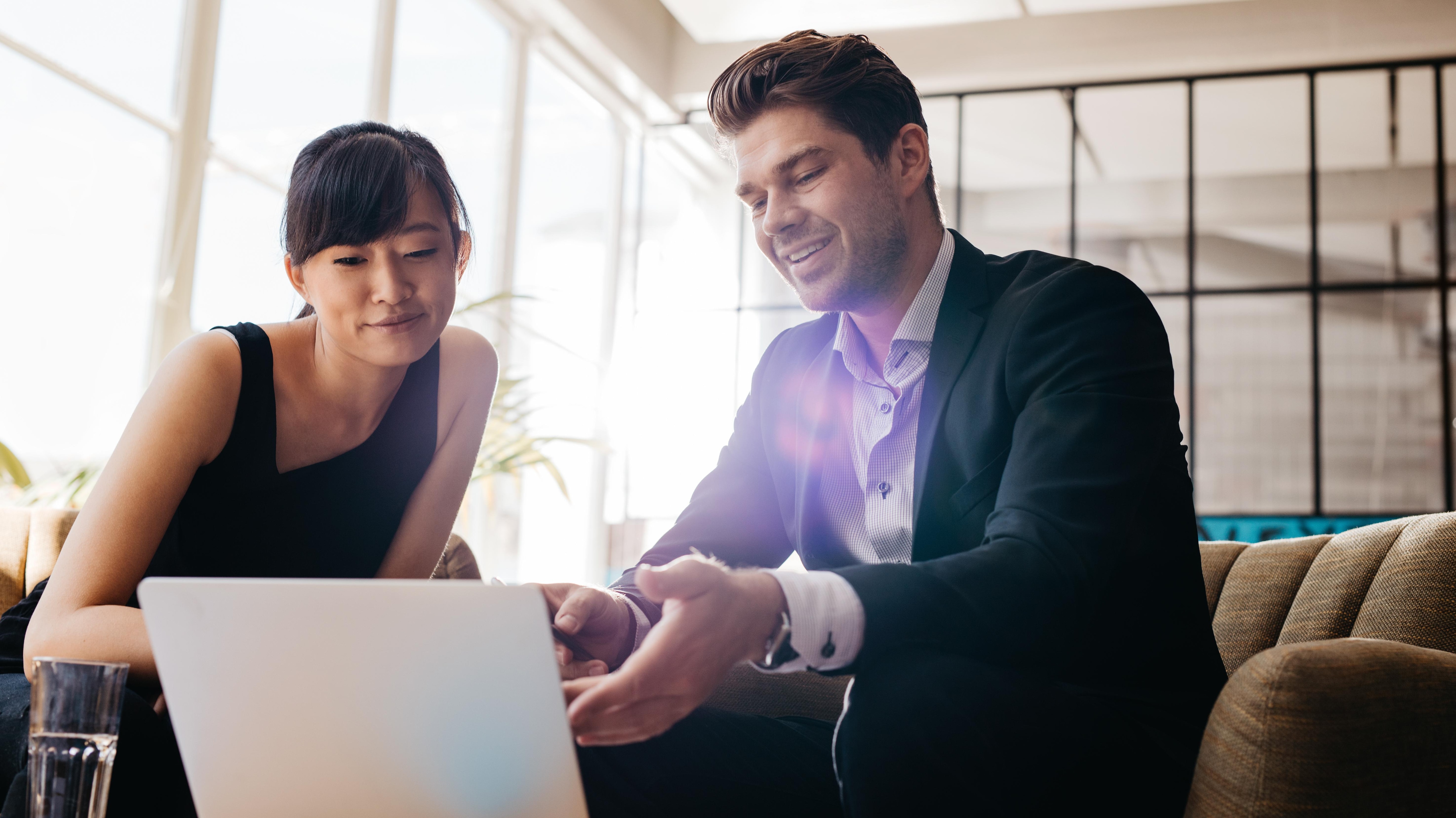 two happy workers in a meeting