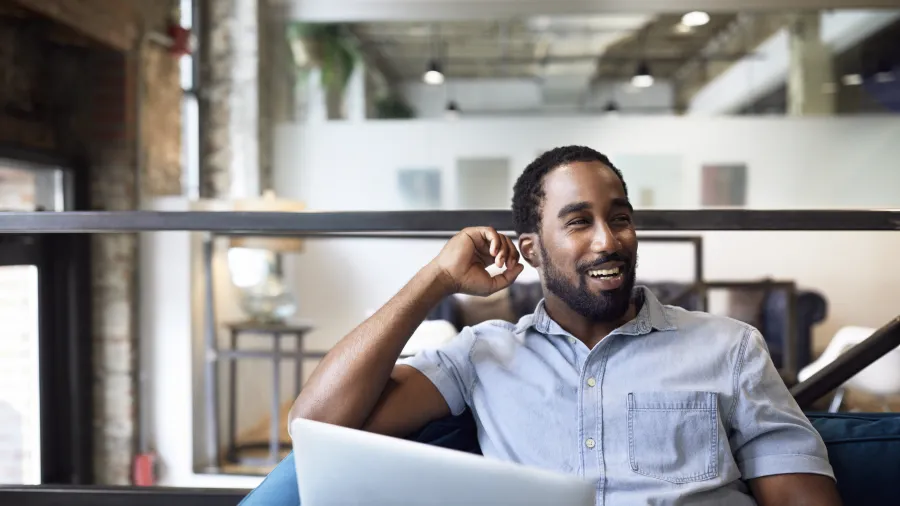 happy worker at laptop