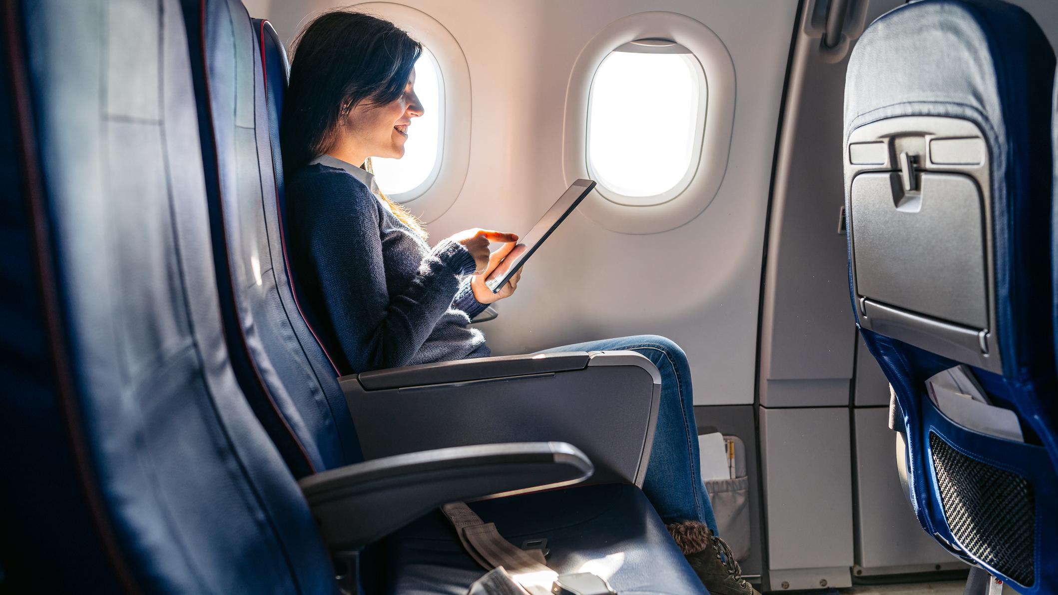 Business professional in airplane seat