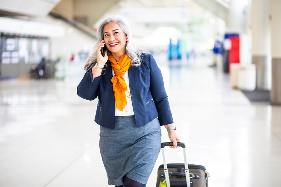 woman on the phone at the airport