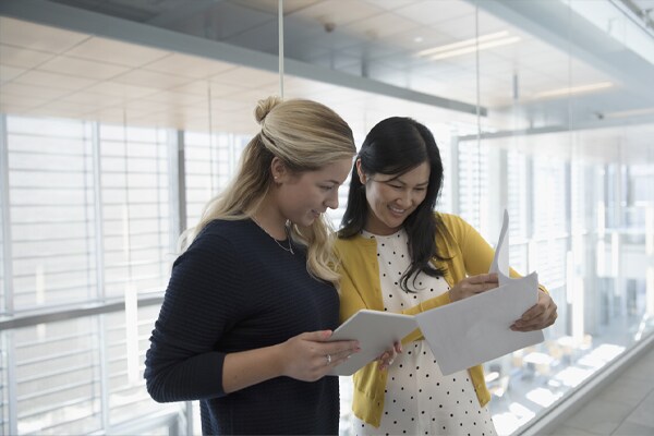 two people working together
