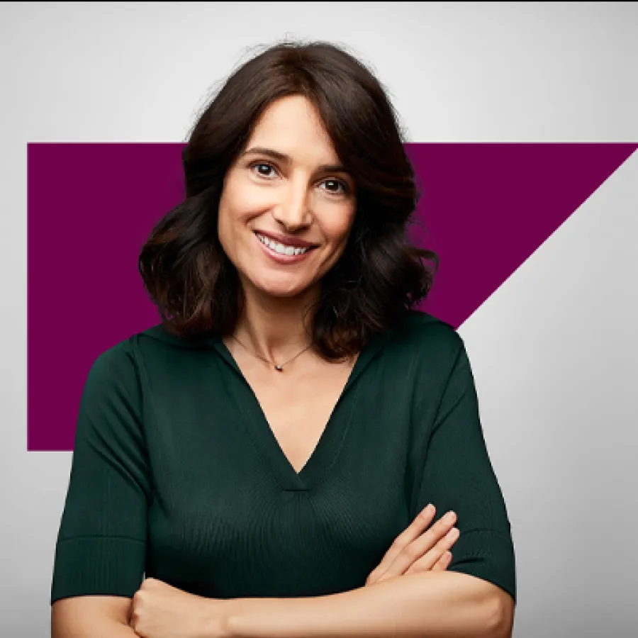 smiling woman with arms crossed