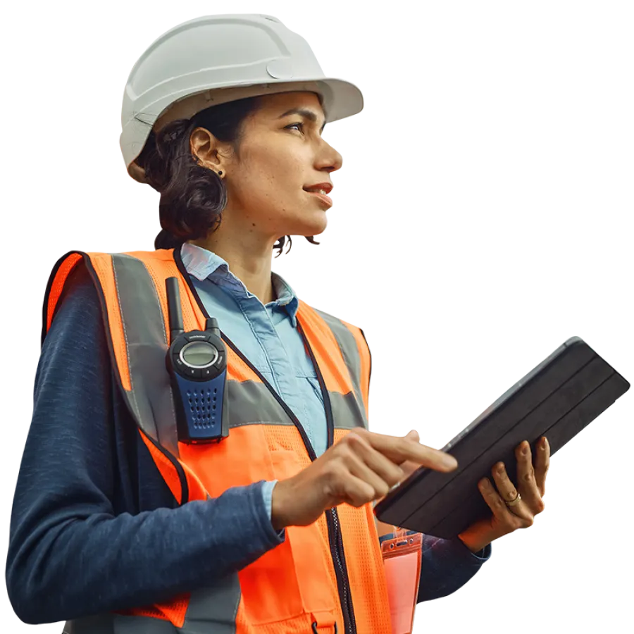 person in hardhat and vest with tablet