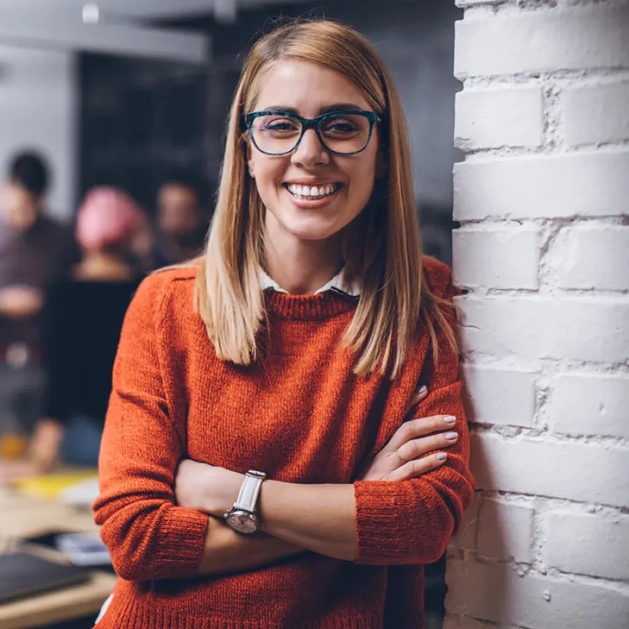 woman smiling with arms crossed