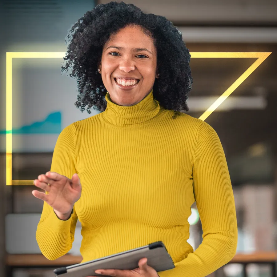 woman smiling holding tablet