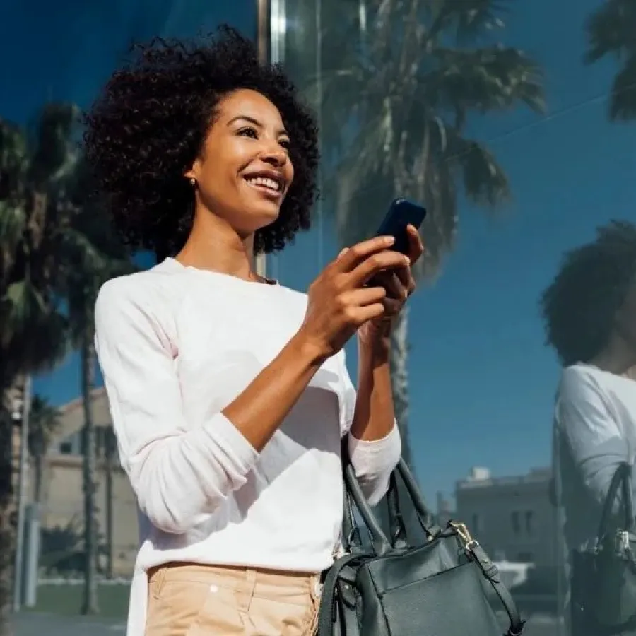 woman walking with phone in hand