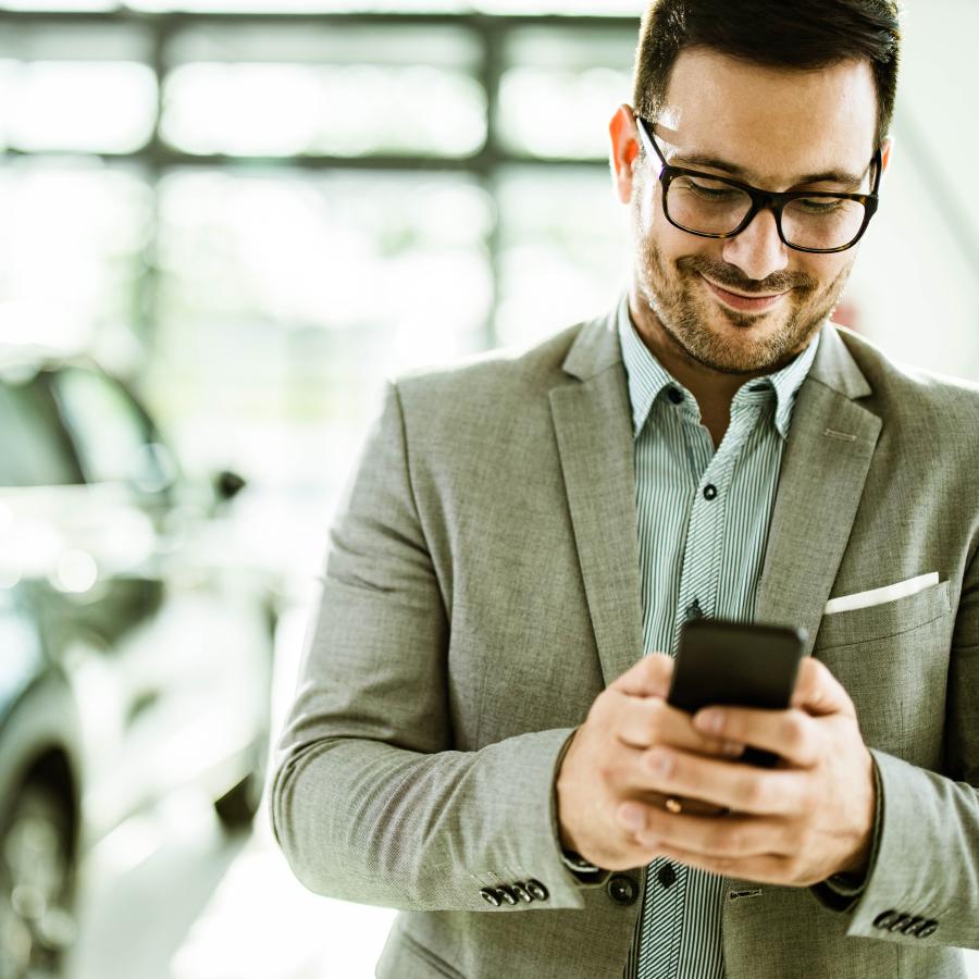 man using app on his phone for travel