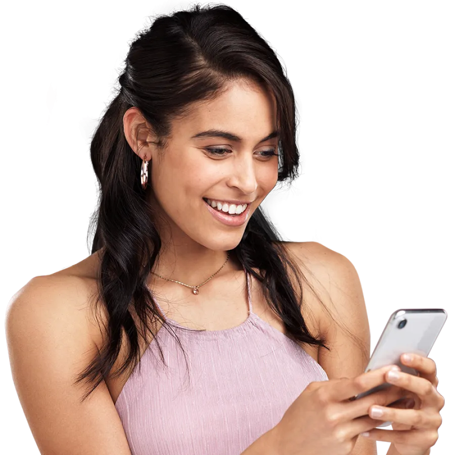 person looking at their phone and smiling