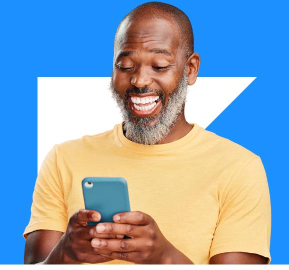 man smiling at phone