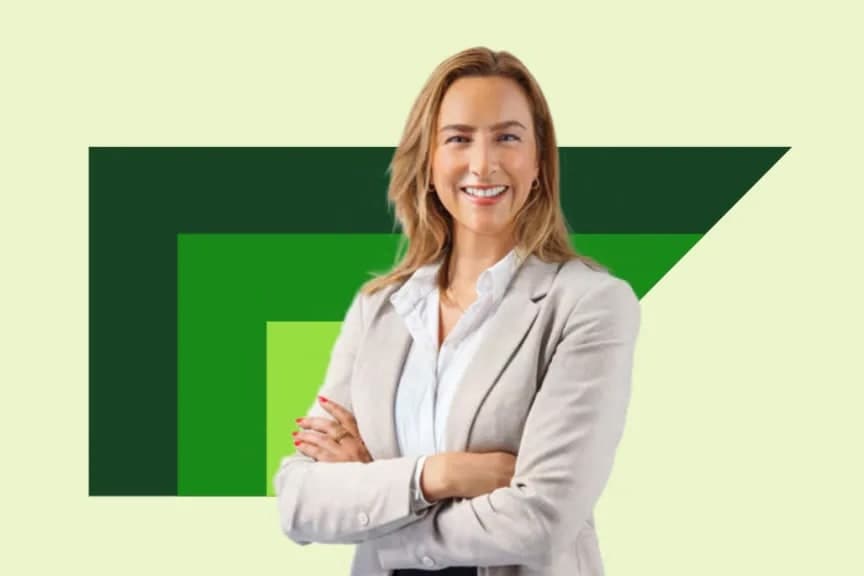 Woman with arms crossed in front of green SAP anvil logo