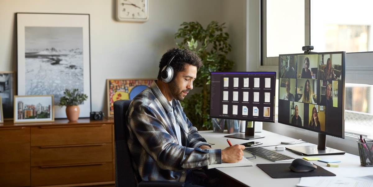 man with headphones on working from home 