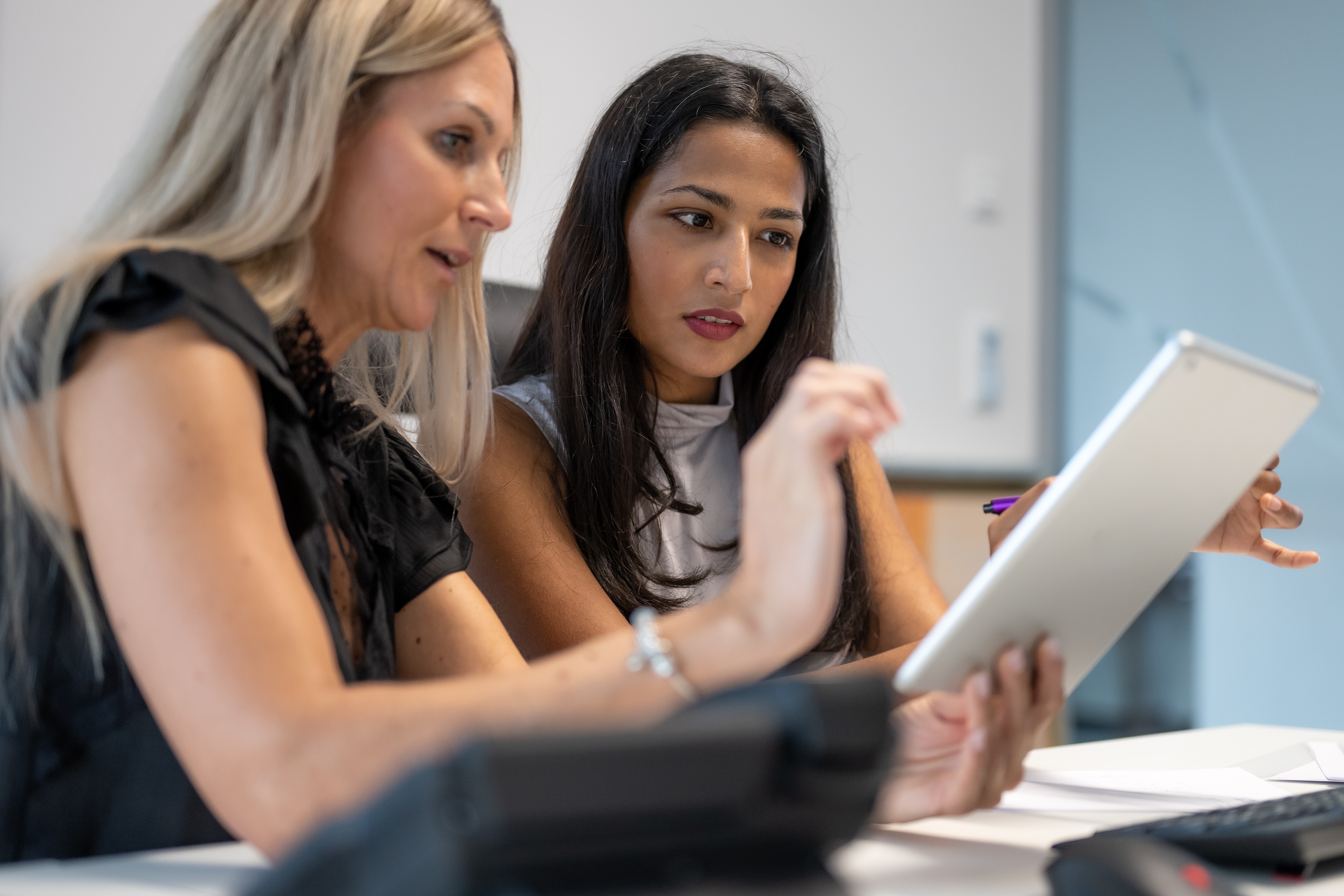 Business people reviewing fraud report