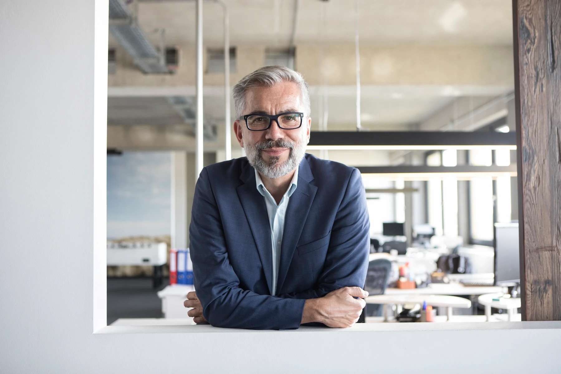 Man wearing glasses and smiling