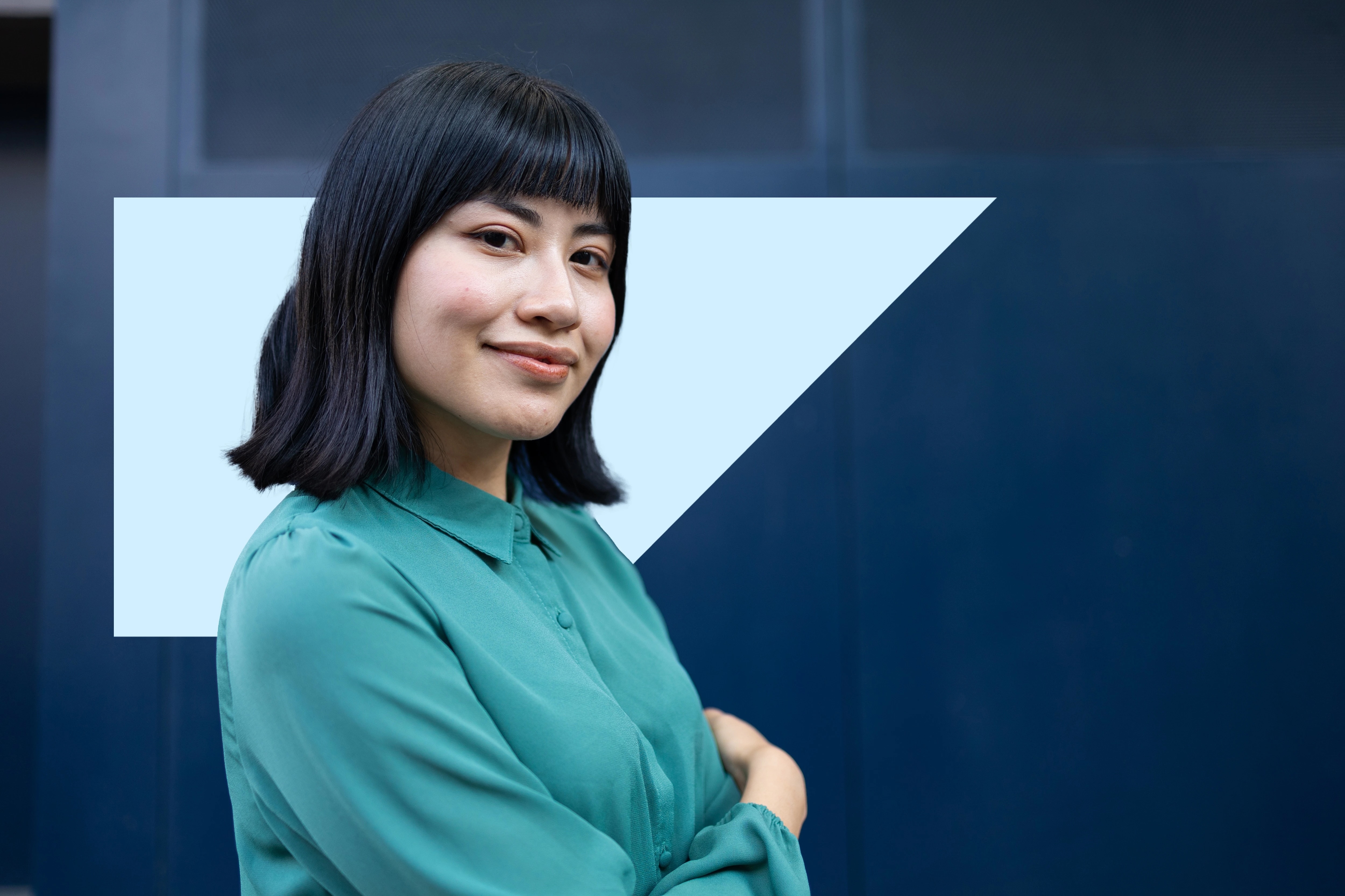 two people in office viewing laptop