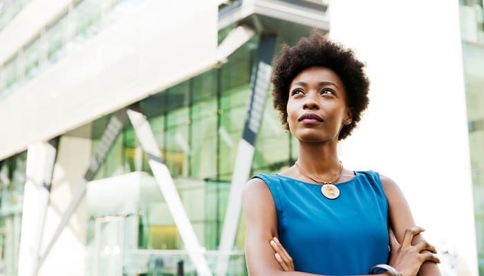 a woman standing in front of a building
