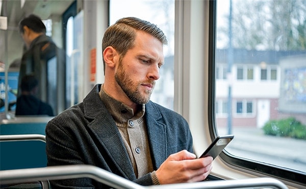 man looking at phone