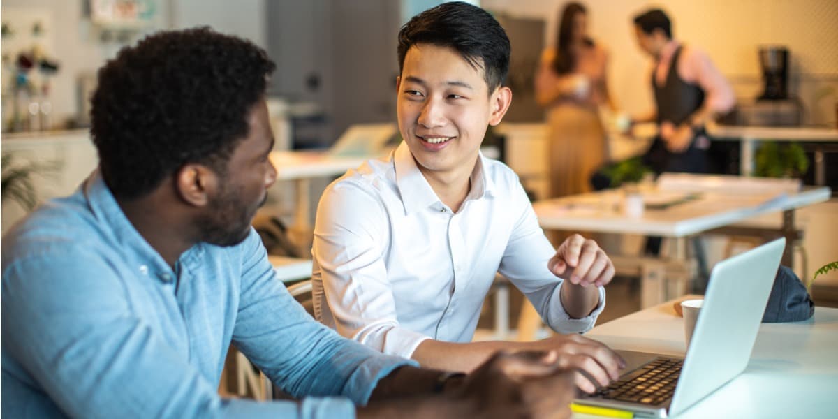 two people talking and smiling